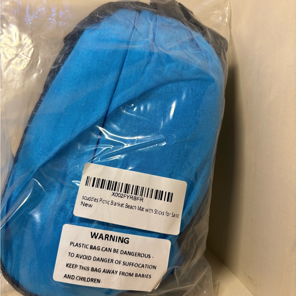 Blue Beach Mat with Stakes.